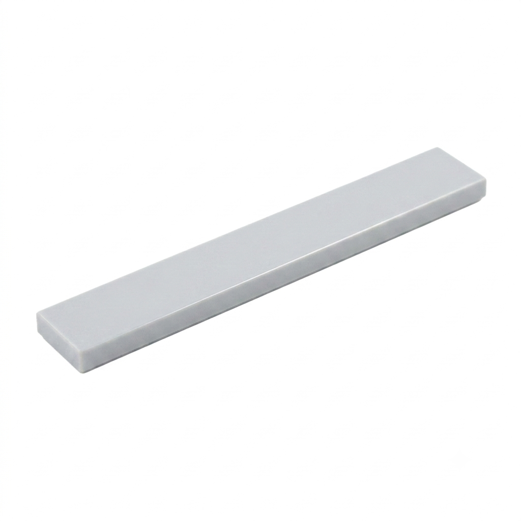 Grey 1x6 smooth building tile on a white background