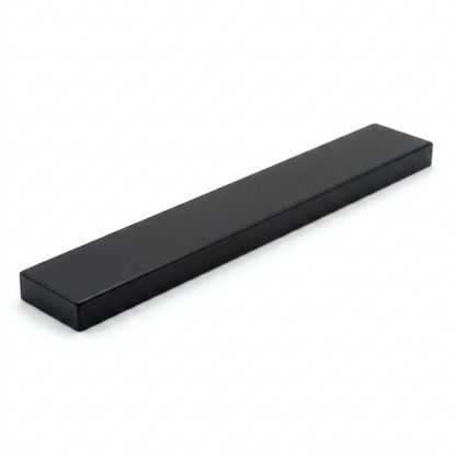 Black 1x8 smooth building tile on a white background