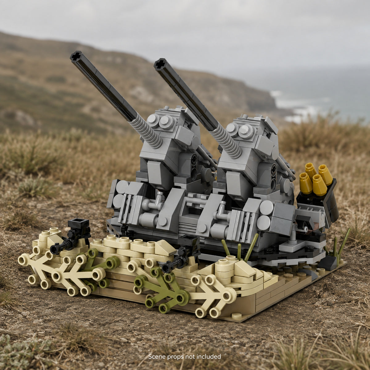 Twin flak guns brick build on coastal grassland; scene props not included.