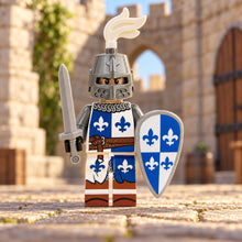 Blue Fleur-de-Lis knight with shield and sword in a castle courtyard; scenery not included
