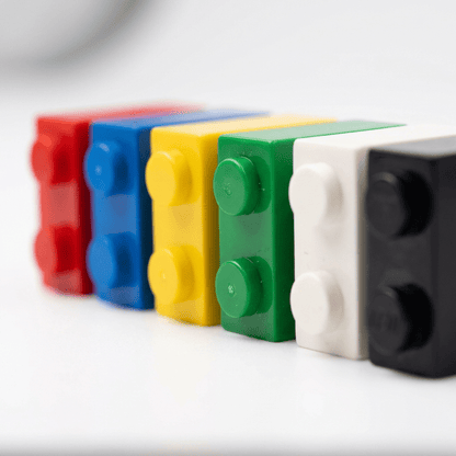 Building bricks in red, blue, yellow, green, white and black