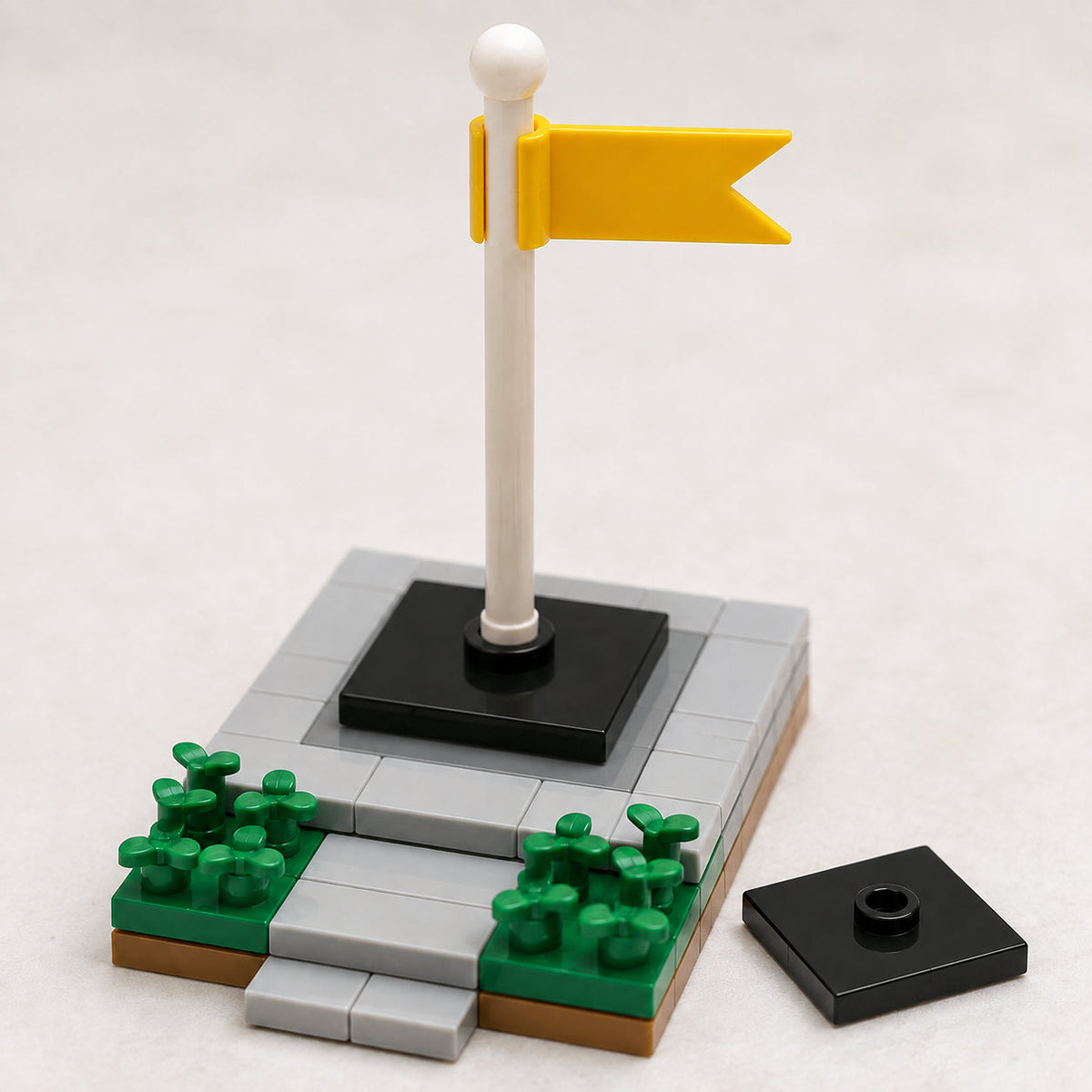 Black 2x2 center-stud jumper plate flagpole scene
