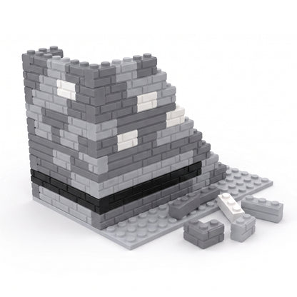 Half-built castle tower made from gray, black and white Masonry Style Bricks